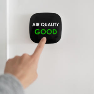 A smart thermostat with Air Quality Good shown on it
