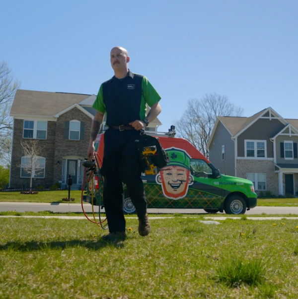 A Dugan Air hvac technician walking to replace an hvac system