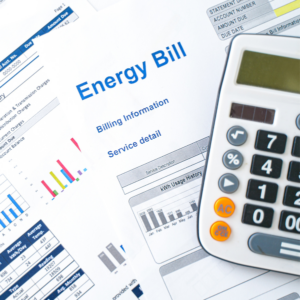 A close-up of an energy bill and calculator